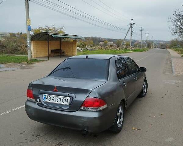 Серый Мицубиси Лансер, объемом двигателя 1.6 л и пробегом 250 тыс. км за 3800 $, фото 1 на Automoto.ua