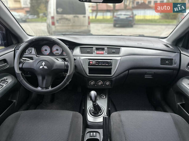 Сірий Міцубісі Lancer, об'ємом двигуна 1.6 л та пробігом 177 тис. км за 2800 $, фото 34 на Automoto.ua