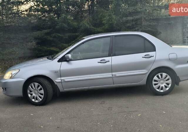 Сірий Міцубісі Lancer, об'ємом двигуна 1.6 л та пробігом 213 тис. км за 3600 $, фото 12 на Automoto.ua