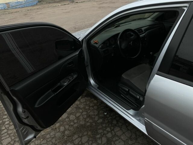 Серый Мицубиси Лансер, объемом двигателя 1.6 л и пробегом 380 тыс. км за 4000 $, фото 11 на Automoto.ua