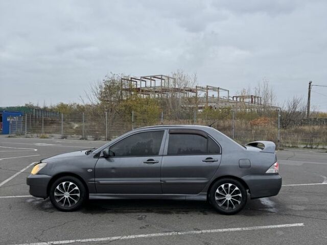 Серый Мицубиси Лансер, объемом двигателя 1.6 л и пробегом 350 тыс. км за 2850 $, фото 4 на Automoto.ua