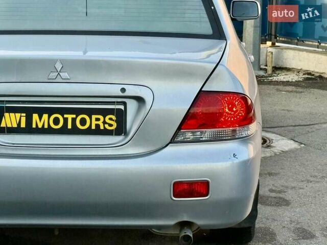 Сірий Міцубісі Lancer, об'ємом двигуна 1.6 л та пробігом 395 тис. км за 4900 $, фото 11 на Automoto.ua