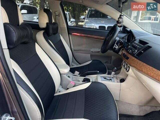 Сірий Міцубісі Lancer, об'ємом двигуна 2 л та пробігом 203 тис. км за 6999 $, фото 20 на Automoto.ua