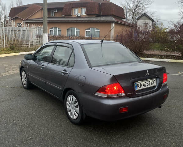 Серый Мицубиси Лансер, объемом двигателя 1.6 л и пробегом 346 тыс. км за 4299 $, фото 1 на Automoto.ua
