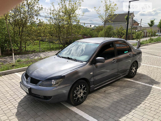 Сірий Міцубісі Lancer, об'ємом двигуна 1.58 л та пробігом 257 тис. км за 4400 $, фото 3 на Automoto.ua