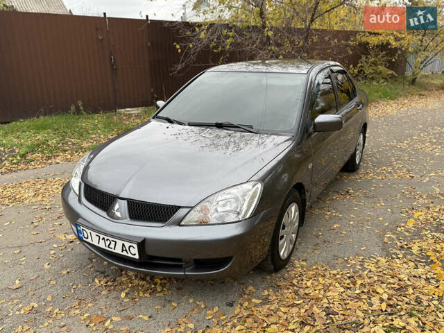 Сірий Міцубісі Lancer, об'ємом двигуна 1.58 л та пробігом 247 тис. км за 4900 $, фото 14 на Automoto.ua