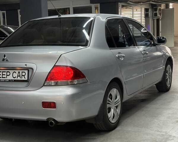 Серый Мицубиси Лансер, объемом двигателя 1.58 л и пробегом 271 тыс. км за 4200 $, фото 13 на Automoto.ua