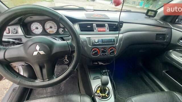 Сірий Міцубісі Lancer, об'ємом двигуна 1.6 л та пробігом 298 тис. км за 4100 $, фото 77 на Automoto.ua