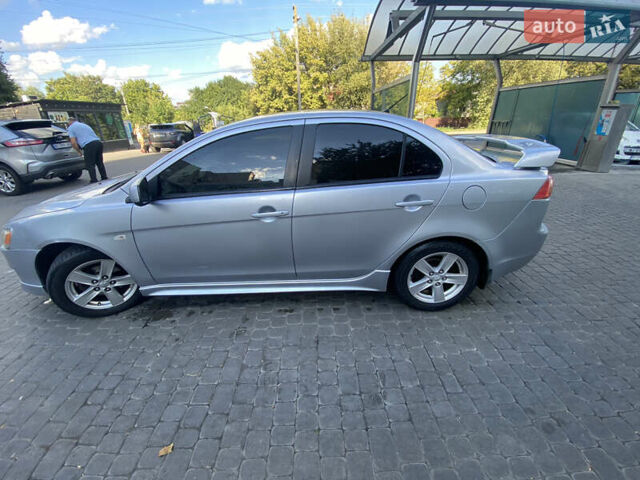 Серый Мицубиси Лансер, объемом двигателя 2 л и пробегом 215 тыс. км за 5750 $, фото 3 на Automoto.ua