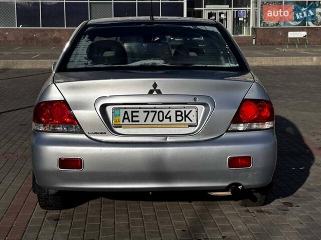Сірий Міцубісі Lancer, об'ємом двигуна 1.6 л та пробігом 237 тис. км за 4950 $, фото 4 на Automoto.ua