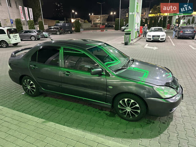 Серый Мицубиси Лансер, объемом двигателя 1.6 л и пробегом 112 тыс. км за 2800 $, фото 8 на Automoto.ua