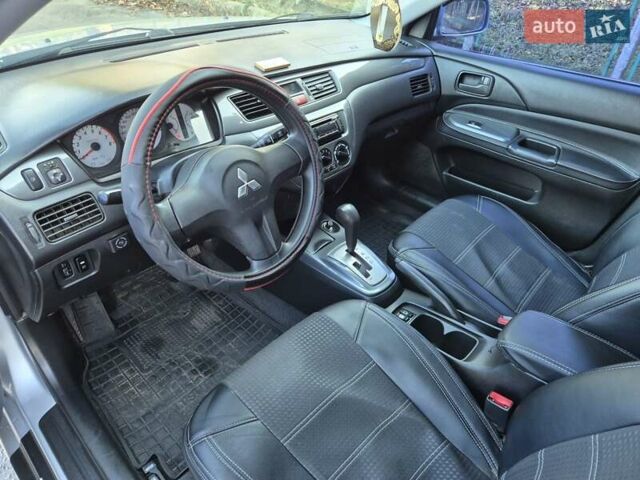 Сірий Міцубісі Lancer, об'ємом двигуна 1.58 л та пробігом 235 тис. км за 5200 $, фото 10 на Automoto.ua