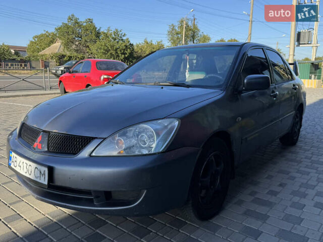 Сірий Міцубісі Lancer, об'ємом двигуна 1.58 л та пробігом 341 тис. км за 2200 $, фото 1 на Automoto.ua