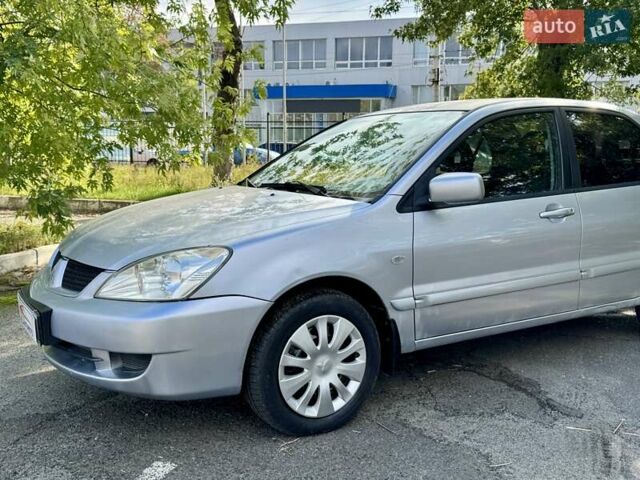 Сірий Міцубісі Lancer, об'ємом двигуна 1.58 л та пробігом 138 тис. км за 4990 $, фото 4 на Automoto.ua