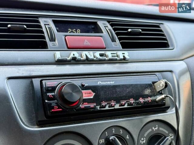 Сірий Міцубісі Lancer, об'ємом двигуна 1.6 л та пробігом 395 тис. км за 4900 $, фото 16 на Automoto.ua