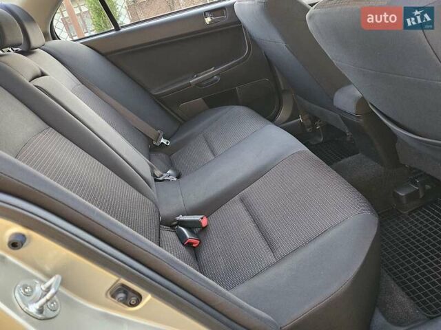 Серый Мицубиси Лансер, объемом двигателя 2 л и пробегом 282 тыс. км за 5450 $, фото 65 на Automoto.ua