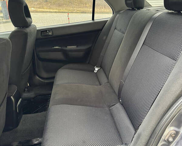 Серый Мицубиси Лансер, объемом двигателя 1.58 л и пробегом 187 тыс. км за 4800 $, фото 5 на Automoto.ua