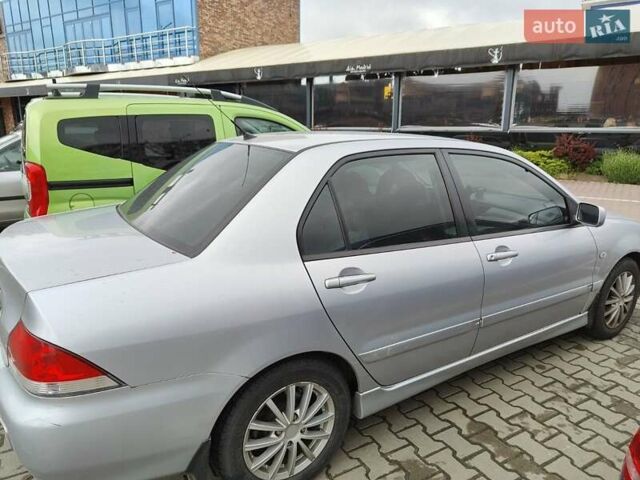 Сірий Міцубісі Lancer, об'ємом двигуна 1.58 л та пробігом 168 тис. км за 5700 $, фото 3 на Automoto.ua