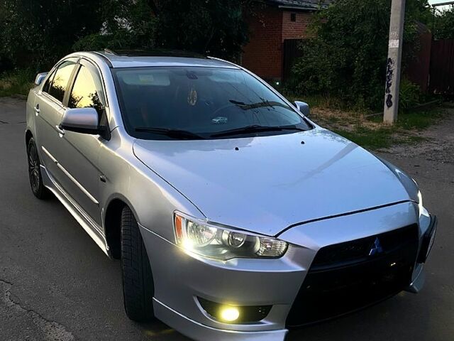 Серый Мицубиси Лансер, объемом двигателя 2 л и пробегом 220 тыс. км за 6500 $, фото 3 на Automoto.ua