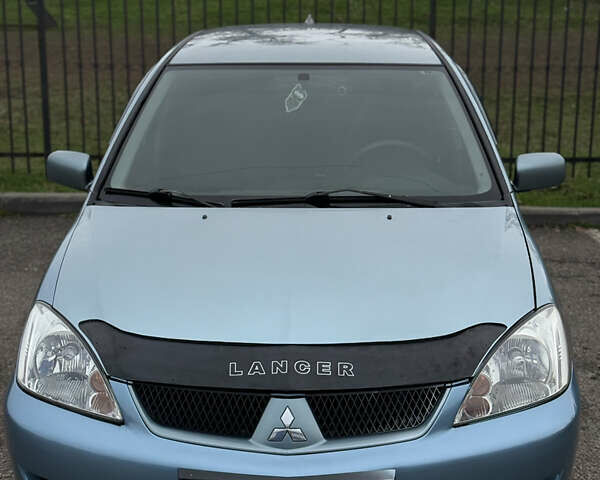 Серый Мицубиси Лансер, объемом двигателя 1.6 л и пробегом 238 тыс. км за 4400 $, фото 6 на Automoto.ua