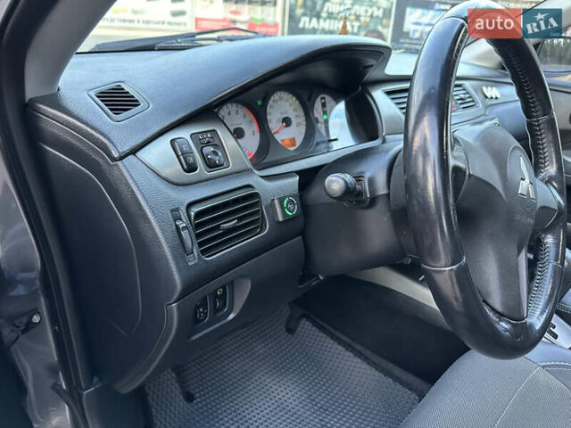 Сірий Міцубісі Lancer, об'ємом двигуна 1.6 л та пробігом 189 тис. км за 6200 $, фото 18 на Automoto.ua
