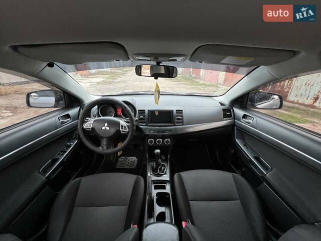 Серый Мицубиси Лансер, объемом двигателя 2 л и пробегом 180 тыс. км за 6799 $, фото 6 на Automoto.ua