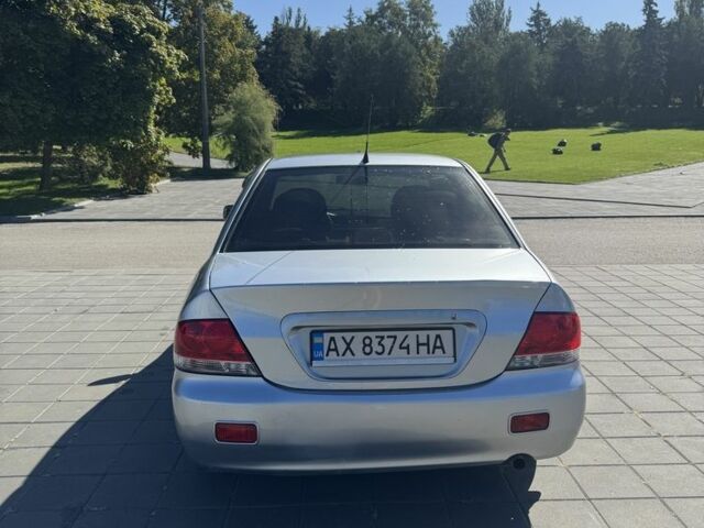 Серый Мицубиси Лансер, объемом двигателя 1.6 л и пробегом 265 тыс. км за 4100 $, фото 4 на Automoto.ua