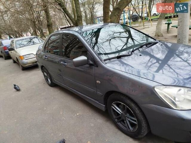 Сірий Міцубісі Lancer, об'ємом двигуна 1.58 л та пробігом 250 тис. км за 4750 $, фото 2 на Automoto.ua