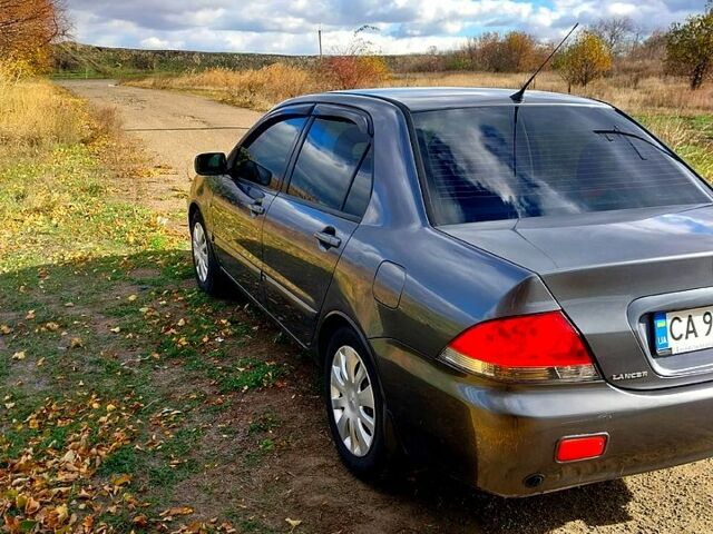 Сірий Міцубісі Lancer, об'ємом двигуна 1.6 л та пробігом 229 тис. км за 4500 $, фото 2 на Automoto.ua