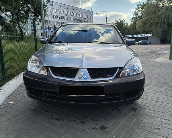 Серый Мицубиси Лансер, объемом двигателя 1.6 л и пробегом 204 тыс. км за 3750 $, фото 9 на Automoto.ua