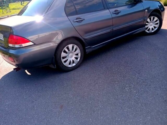 Сірий Міцубісі Lancer, об'ємом двигуна 1.6 л та пробігом 300 тис. км за 4400 $, фото 2 на Automoto.ua