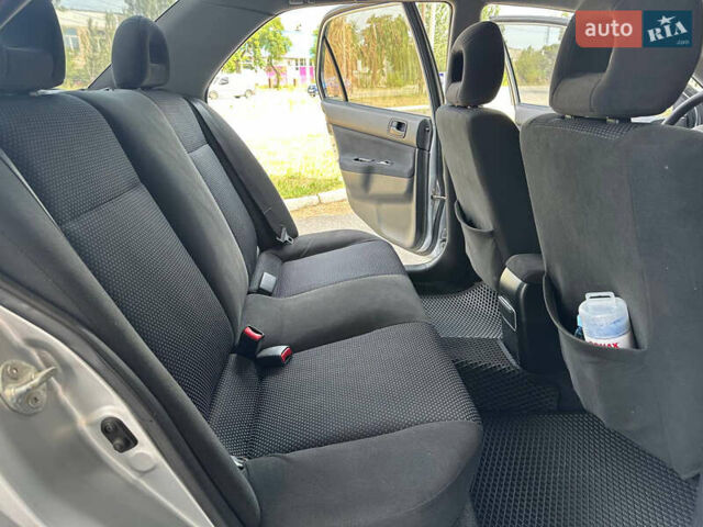 Сірий Міцубісі Lancer, об'ємом двигуна 1.58 л та пробігом 181 тис. км за 5699 $, фото 28 на Automoto.ua