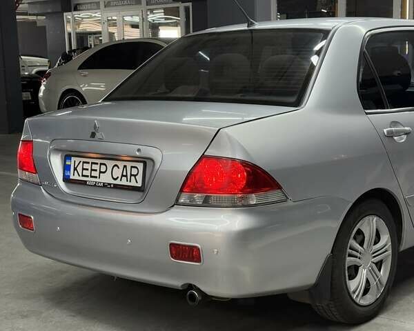 Серый Мицубиси Лансер, объемом двигателя 1.58 л и пробегом 271 тыс. км за 4200 $, фото 15 на Automoto.ua