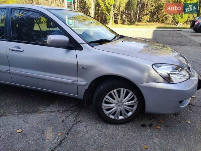 Сірий Міцубісі Lancer, об'ємом двигуна 1.58 л та пробігом 122 тис. км за 6300 $, фото 14 на Automoto.ua