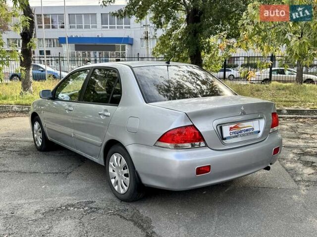Сірий Міцубісі Lancer, об'ємом двигуна 1.58 л та пробігом 138 тис. км за 4990 $, фото 8 на Automoto.ua