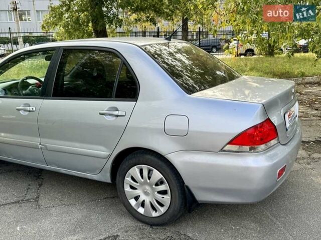 Сірий Міцубісі Lancer, об'ємом двигуна 1.58 л та пробігом 138 тис. км за 4990 $, фото 9 на Automoto.ua