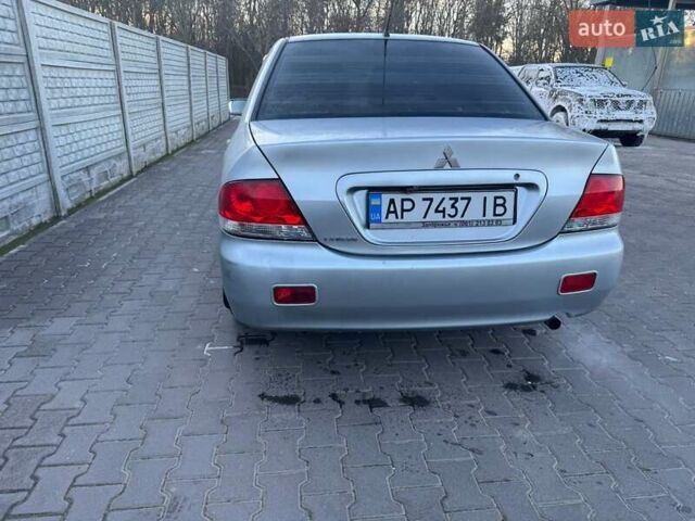 Серый Мицубиси Лансер, объемом двигателя 1.6 л и пробегом 256 тыс. км за 4500 $, фото 1 на Automoto.ua