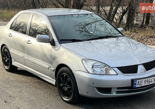 Серый Мицубиси Лансер, объемом двигателя 1.58 л и пробегом 290 тыс. км за 3750 $, фото 10 на Automoto.ua