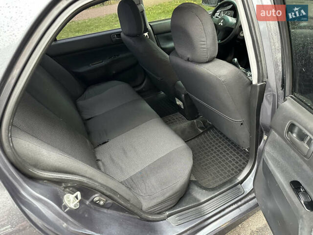 Серый Мицубиси Лансер, объемом двигателя 1.6 л и пробегом 115 тыс. км за 2800 $, фото 9 на Automoto.ua