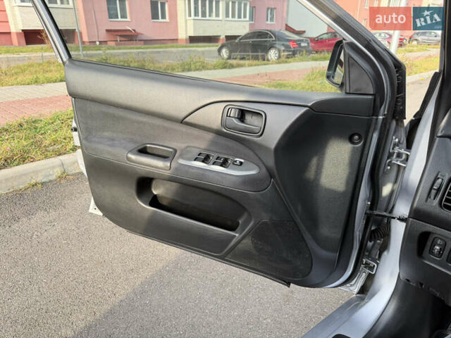 Серый Мицубиси Лансер, объемом двигателя 1.3 л и пробегом 160 тыс. км за 5555 $, фото 40 на Automoto.ua