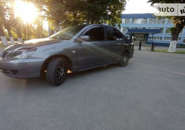 Сірий Міцубісі Lancer, об'ємом двигуна 1.6 л та пробігом 230 тис. км за 3950 $, фото 15 на Automoto.ua