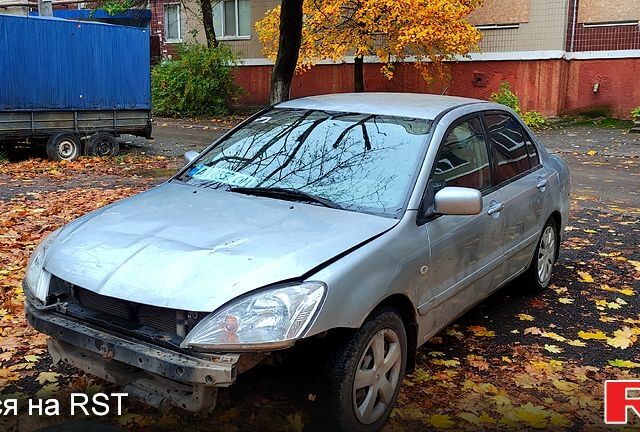 Серый Мицубиси Лансер, объемом двигателя 1.6 л и пробегом 430 тыс. км за 2500 $, фото 4 на Automoto.ua