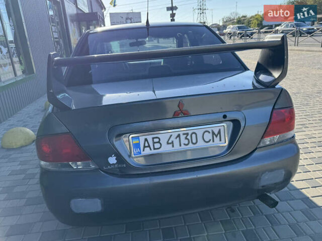 Сірий Міцубісі Lancer, об'ємом двигуна 1.58 л та пробігом 341 тис. км за 2200 $, фото 8 на Automoto.ua