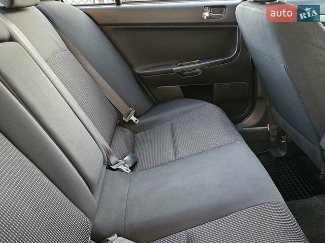 Серый Мицубиси Лансер, объемом двигателя 2 л и пробегом 282 тыс. км за 5450 $, фото 70 на Automoto.ua