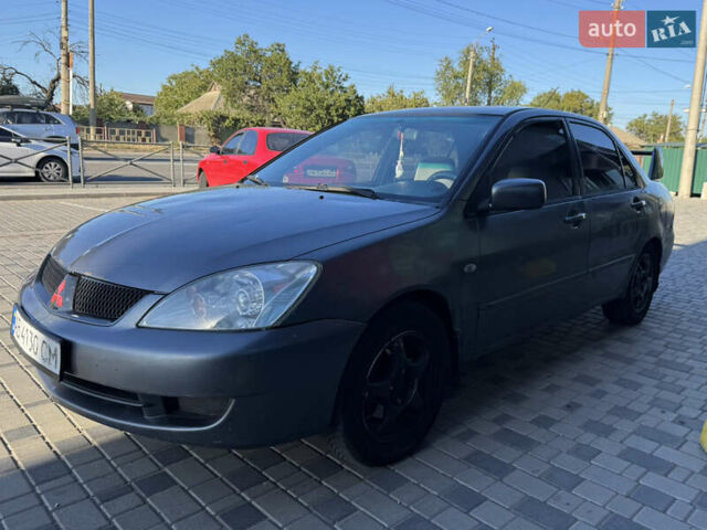 Сірий Міцубісі Lancer, об'ємом двигуна 1.58 л та пробігом 341 тис. км за 2200 $, фото 2 на Automoto.ua