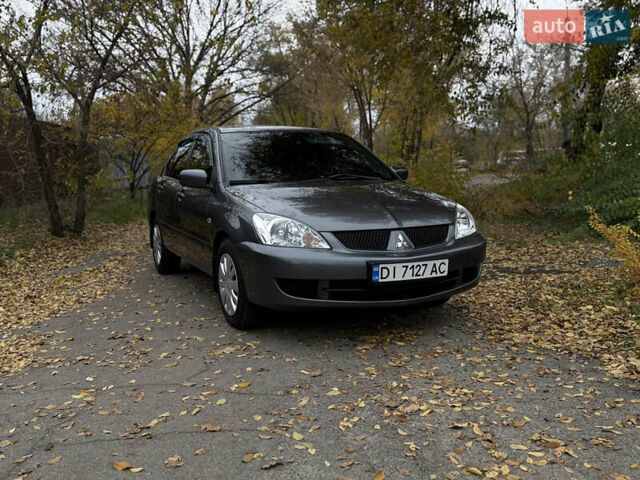 Сірий Міцубісі Lancer, об'ємом двигуна 1.58 л та пробігом 247 тис. км за 4900 $, фото 1 на Automoto.ua