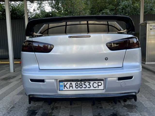 Серый Мицубиси Лансер, объемом двигателя 2 л и пробегом 244 тыс. км за 6500 $, фото 7 на Automoto.ua