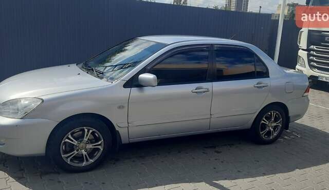 Серый Мицубиси Лансер, объемом двигателя 1.6 л и пробегом 420 тыс. км за 4900 $, фото 9 на Automoto.ua