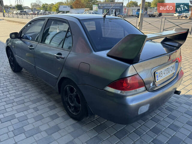 Сірий Міцубісі Lancer, об'ємом двигуна 1.58 л та пробігом 341 тис. км за 2200 $, фото 9 на Automoto.ua
