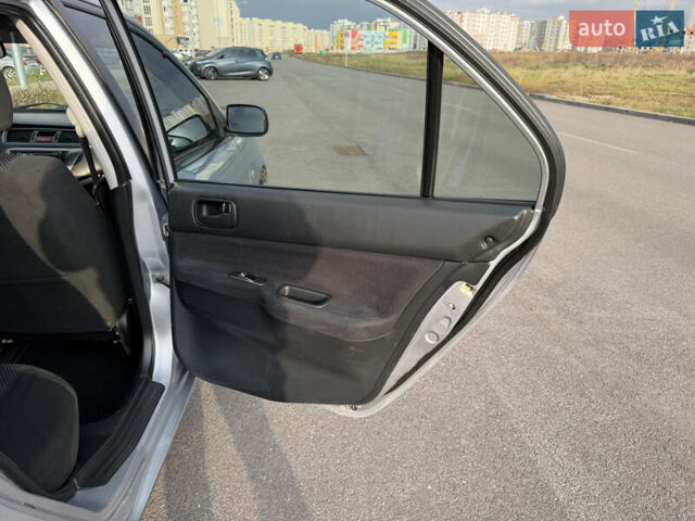 Серый Мицубиси Лансер, объемом двигателя 1.3 л и пробегом 160 тыс. км за 5555 $, фото 58 на Automoto.ua